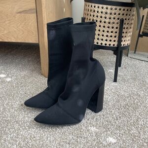 Black sock bootie heels